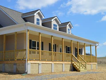 Porch Living New 3 bedroom 3 bath home on Client's 10 acres. All bedrooms on first floor, kitchen, breakfast nook, family room, 2 baths. Upstairs play