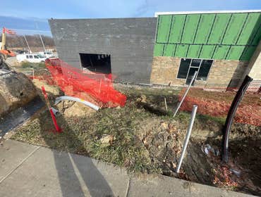 Photos by Spread the Light Homes LLC #4 Trench for underground electrical to commercial buildings.