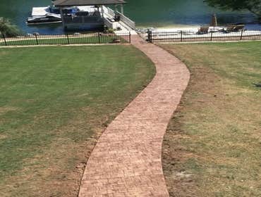 Photos by Stamped Concrete Denver LLC #1 Stamped concrete, often called textured or imprinted concrete, replicates the look of many different stones su