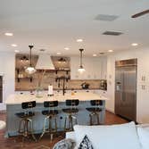Photos by Jmc Builders Group LLC #1 Complete tear out and remodel with white shaker cabinets , custom oak shelving and bench