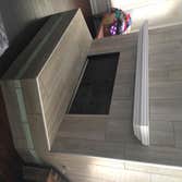 Fireplaces Replaced stone work with a faux wood ceramic tile and glass tiles