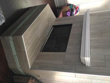 Fireplaces Replaced stone work with a faux wood ceramic tile and glass tiles