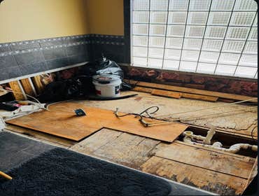Photos by Gc Contractors #2 Removed old jacuzzi tub that was leaking. fixed leak and floor and added tile and a new standalone tub ordered by customer.