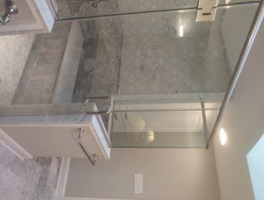 Photos by Middletown Kitchen & Bath LLC #2 Regal Award Winning complete master bath remodel with Carrara Marble Tile.