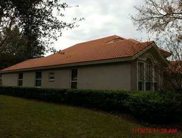 Photos from Popa Construction LLC Before & Afters of a soft wash roof cleaning and driveway and side walk cleaning.