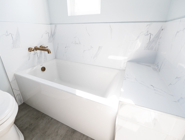 Photos by American Home Improvement #12 2 Modern Matching Bathroom Remodels