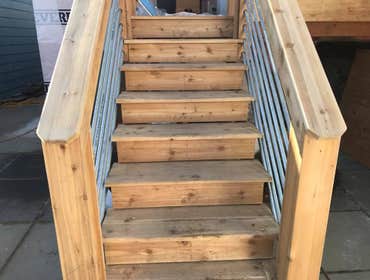 Modern Deck Project Replace existing deck and add square footage, update look of railing to match building aesthetic