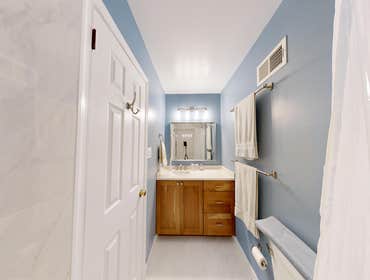 David's Bathroom Reno! Bright bathroom inspiration with soft blue walls, natural wood vanity cabinets, and sleek white finishes. A timeless remodel ide