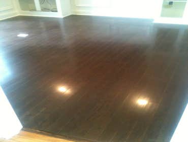 A family's living room and kitchen installed with laminate This project started out with us removing the old existing carpet in the living room and old