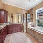 Custom Home in Harmony, FL Custom Single-Family Home with 4 Bedcrooms, 5 Baths, Study, Theater Room, Game Room, Outdoor Living Space and more!