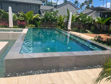 Photos by Hard Rocking Hawaii, Inc. #2 New negative edge pool with a sunning deck and a spa