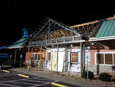 putting on new metal roofing