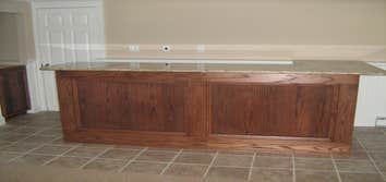 Project photos from Shaun P Hamilton Kitchen remodle in cherry, With Bilevel island. 20 X 30 Composite deck project complete. Interior trim project in 