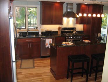 Project photos from Shaun P Hamilton Kitchen remodle in cherry, With Bilevel island. 20 X 30 Composite deck project complete. Interior trim project in 
