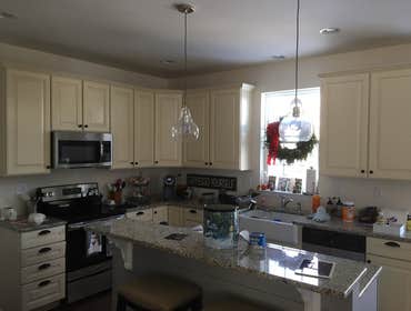 Kitchen install with shiplap on 12 wall and fireplace wall. Shiplap on bathroom with trim
