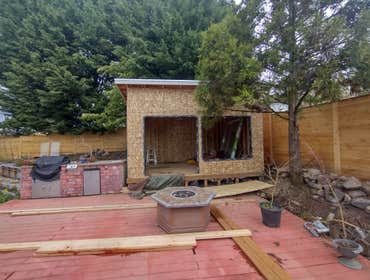 Photos by Stewart & Son Gate & Fence LLC #1 Tiny House with pergola. Small house 17' by 12' small bathroom with pocket door, and small sink with water 