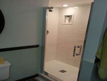 SHOWER REMODEL (Elmer NJ) -Remove old shower stall.
-Move 2 walls to make the shower wider and longer.
-Mosaic tile with 2 can lights in the ceiling