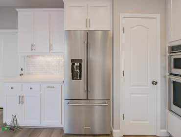 Full Home Remodel Full home remodel featuring a very modern take on a kitchen, fireplace, and bathroom. The color coordination throughout the home give