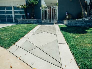 Front Patio & Outdoor Kitchen Remodel Patio Block Diamond Pattern with Rugged Texture, Outdoor Kitchen and seating area, waterfall fixtures Hardscape &