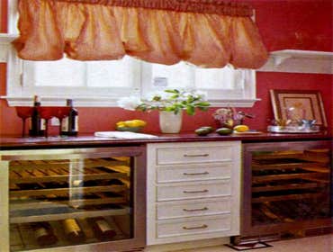 Flirting with formality A ceramic farmhouse sink and vintage-style faucet suit the formal character of a 1890s home. A floral motif on the sink apron a