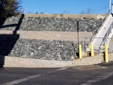 Photos by Margarella Industrial Con #1 Before and After of a Newly Installed Retainer Wall