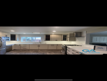 Complete kitchen cabinet refinish including new countertop and backsplash installation