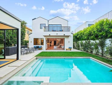 Gretna Green Way Built by Energize Builders Inc., this modern Brentwood home blends luxury and innovation. Featuring natural finishes, seamless indoor-