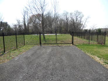 Sentinal black aluminum in Malvern This is a beautiful 54 inch black aluminum fence with swing out self closing estate gates with magnetic latches. Al