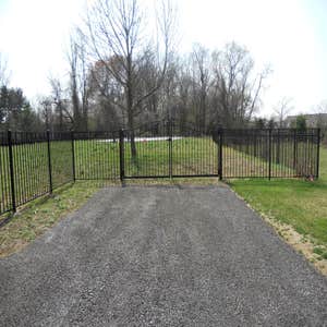 Sentinal black aluminum in Malvern This is a beautiful 54 inch black aluminum fence with swing out self closing estate gates with magnetic...