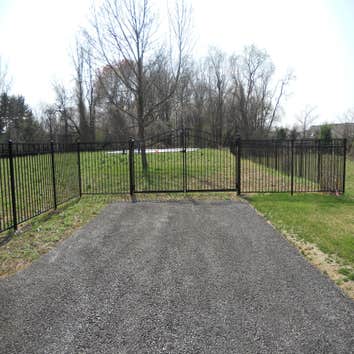 Sentinal black aluminum in Malvern This is a beautiful 54 inch black aluminum fence with swing out self closing estate gates with magnetic latches. Al