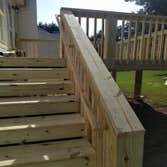 Deck Rebuild demo & haul-off existing deck with the following issues: 1) open risers 2) missing flashing 3) deteriorated handrails 4) loose guardrailin