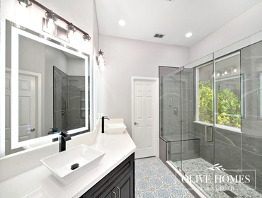 Modern Luxury Master Bathroom Remodel in Lincoln, CA 95648 This master bathroom remodel delivers modern luxury through high contrast and bold fixtures.