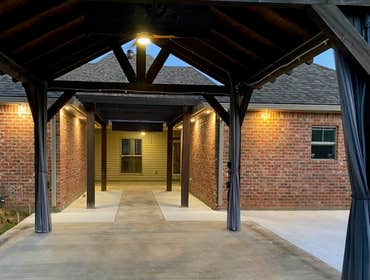 Photos by Dupont Technical Services #1 Kazeebo power. W fan added, motorized TV ceiling mount w 5 receptacles. And recess outdoor lighting.