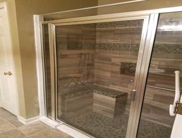 Photos by From the Ground Up #10 Complete demolition of a handicap shower and replacement. Removed fiberglass shower and installed glass tile shower wi