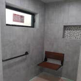 Photos by Ruben Garcia Dba Fast Track Construction #5 Make existing shower a walk in shower. With vanity, painted wood back splash. Relocation of close