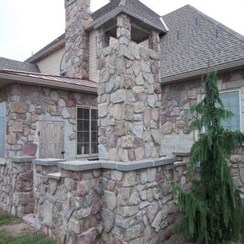 moore job this is outside stairs, seating area, sunk in play area with fire pit. intertaining area