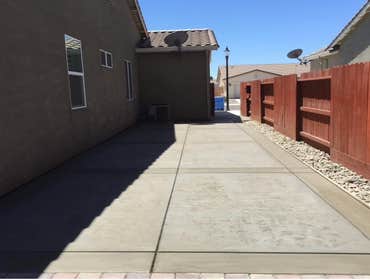 Photos by Cal Valley Landscape #7 Concrete paving, retaining wall with stone surface, columns with lights, courtyard, iron gate and railing, Deck falco