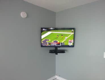 Wall Mount TV Remove TV from stand and add TV mount. Add additional receptacle concealed behind TV. Reinstall all cables. Install glass DVD player shel