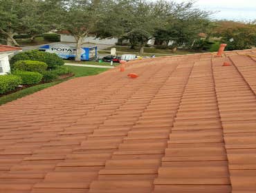 Photos from Popa Construction LLC Before & Afters of a soft wash roof cleaning and driveway and side walk cleaning.