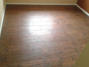 Wood plank tile floor 9"x36" Wood plank porcelain tile with random joints