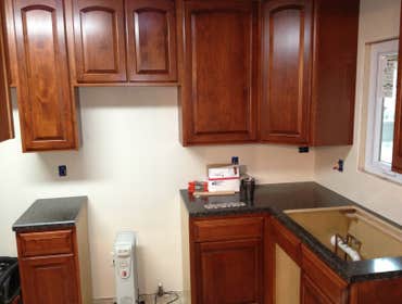Adam R. Nardecchia Electrical Service Project In the first few pictures is a brand new maple kitchen being installed with custom counter tops which are