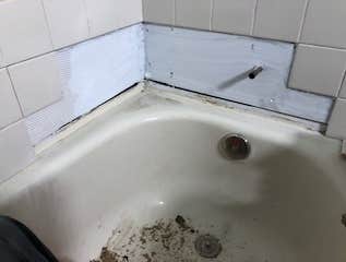 Photos by Mr Honey Do Home Improvement LLC #1 removed existing loose tiles with favorable site conditions. Removed water damaged drywall. Cleaned tiles