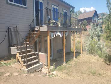 Photos by Colorado Painting & Construction Pros #1 Tear down old deck with no stairs and build new with stair access to the yard and build a second dec