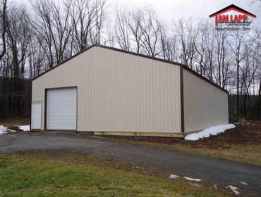 40'W x 60'L x 12'H Commercial Polebarn Building in White Haven, Pennsylvania Project Overview
(1)- 10′Wx10′H Garage Door.
36″ 6 Panel Entry Door.
<a 