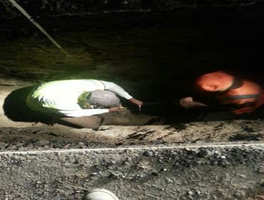 TAPPING MAIN & WATER LINE INSTALLATION Hot Tapping a 10 inch Water Main, Running 300 ft of 2inch water supply with back flow preventer