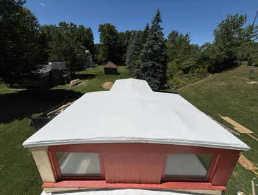 Photos by Ideal Roofing LLC #1 Complete rebuild of an old train caboose that had a rotten roofing frame and deck.