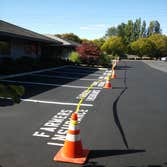 Bellevue Office Park Seal/Stripe Repaired parking lot curbing, filled all cracks in asphalt, 2 coats of Sealcoat and Lot striping with personalized par