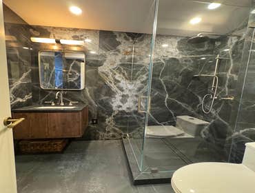 Bathroom Gut Renovation Evolution Group completed a full renovation of a contemporary bathroom, featuring a complete replacement of all fixtures, finis