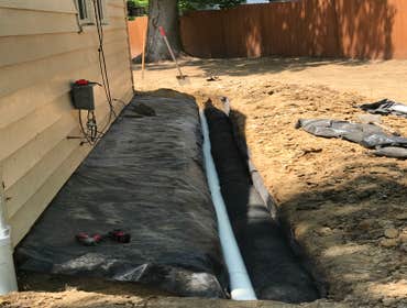 Photos by Madlandscape #6 This was a French drain, build all the way around the house to prevent water from going into the basement. Basically any wate