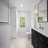 Bathroom Remodel - Project Type: Bathroom Remodel
Products Used: Tile, flooring, vanity, cabinets, faucets, hardware, sink, and mirror.